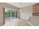 Bright dining area with sliding glass doors leading to a deck and a view of the water at 542 Hadleigh Ct, Westfield, IN 46074