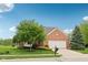 Charming brick home with a two-car garage and well-manicured lawn, enhancing curb appeal at 542 Hadleigh Ct, Westfield, IN 46074
