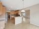 Bright kitchen with stainless steel appliances, wooden cabinets, and hardwood floors at 542 Hadleigh Ct, Westfield, IN 46074