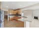 Well-lit kitchen with stainless appliances, light wood cabinets, and mosaic backsplash at 542 Hadleigh Ct, Westfield, IN 46074