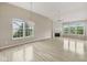 Bright, open living room featuring hardwood floors, fireplace, and large windows at 542 Hadleigh Ct, Westfield, IN 46074