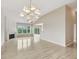 Bright, open living room featuring hardwood floors, fireplace, and large windows at 542 Hadleigh Ct, Westfield, IN 46074