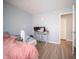 Bedroom view with desk and doorway; neutral paint; plank flooring at 5622 Mead Ct, Indianapolis, IN 46220