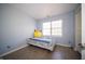 Bedroom featuring a cozy bed, wood-look flooring, and a window for natural light at 5622 Mead Ct, Indianapolis, IN 46220