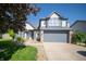 Charming two-story home with a two-car garage and well-manicured front yard at 5622 Mead Ct, Indianapolis, IN 46220