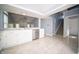 Updated kitchen featuring white cabinetry, stainless steel appliances, and durable floors at 5622 Mead Ct, Indianapolis, IN 46220