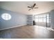 Spacious, light-filled living room with wood-look floors, and shelving for added storage and decor at 5622 Mead Ct, Indianapolis, IN 46220