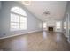 Bright, open living room with hardwood floors, vaulted ceiling, and cozy fireplace at 5622 Mead Ct, Indianapolis, IN 46220