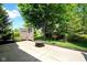Relaxing backyard features patio with fire pit and mature trees for shade and privacy at 575 Dylan Dr, Avon, IN 46123