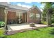 Relaxing backyard patio with outdoor grill, dining table and chairs, and a cozy fire pit at 575 Dylan Dr, Avon, IN 46123