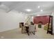 Spacious basement with plush carpet features dining area, stairs to upper floor, and seating area at 575 Dylan Dr, Avon, IN 46123