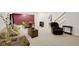 Spacious basement features plush carpet, stairs to upper floor, and comfortable seating area at 575 Dylan Dr, Avon, IN 46123
