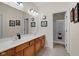 Neutral bathroom features double sinks, wood cabinets, and glass shower door at 575 Dylan Dr, Avon, IN 46123