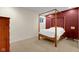 Spacious bedroom featuring a four-poster bed, plush carpet, and accent wall at 575 Dylan Dr, Avon, IN 46123