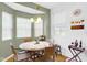 Inviting dining area with hardwood floors, a chandelier, and natural light from surrounding windows at 575 Dylan Dr, Avon, IN 46123