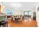 Bright dining area with hardwood floors, and chandelier flowing to living room, and kitchen at 575 Dylan Dr, Avon, IN 46123