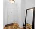 Inviting entryway with hardwood floors, decorative mirror, and stylish lighting at 575 Dylan Dr, Avon, IN 46123