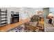 Open-concept living room features hardwood floors and seamlessly connects to the dining and kitchen areas at 575 Dylan Dr, Avon, IN 46123