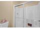 Bright shower features new glass sliding doors and a built-in shower caddy at 575 Dylan Dr, Avon, IN 46123