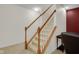 Carpeted staircase with white spindles and wood trim, leads to the lower level at 575 Dylan Dr, Avon, IN 46123