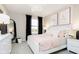 Charming bedroom with a white bed, a pink accent wall, and black-out curtains for a peaceful night's sleep at 583 Dalton Way, Avon, IN 46123