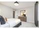 A bright bedroom featuring a dresser with mirror and complementing decor with neutral walls and carpet at 583 Dalton Way, Avon, IN 46123