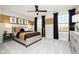 Cozy bedroom featuring neutral tones, a decorative gold stripe, and black curtains that frame the bright windows at 583 Dalton Way, Avon, IN 46123