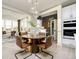 Bright breakfast nook features a round table, seating for four and views of the backyard at 583 Dalton Way, Avon, IN 46123