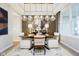 Modern dining room with stylish lighting, neutral decor, and comfortable seating for six at 583 Dalton Way, Avon, IN 46123