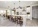 Spacious kitchen with large island, modern appliances, pendant lighting and open floor plan to living area at 583 Dalton Way, Avon, IN 46123