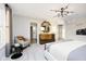 Bright main bedroom with a modern light fixture, adjacent sitting area, and ensuite bathroom entrance at 583 Dalton Way, Avon, IN 46123