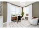 Cozy home office featuring large windows, modern desk and comfortable accent chair at 583 Dalton Way, Avon, IN 46123