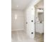 Walk-in closet with an open door to the bathroom and white wire shelving for storage at 583 Dalton Way, Avon, IN 46123