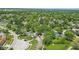 Aerial view of the neighborhood highlights the property’s location among mature trees and tidy lawns at 633 Park Dr, Greenwood, IN 46143