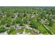 An aerial view shows the location of the property in a leafy, green residential neighborhood at 633 Park Dr, Greenwood, IN 46143