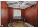 This bedroom has red walls, white trim, and a ceiling fan at 633 Park Dr, Greenwood, IN 46143