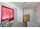 This bedroom has pink walls, white trim, and a ceiling fan at 633 Park Dr, Greenwood, IN 46143