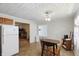 Kitchen with a view into the living room including updated appliances and tile flooring at 633 Park Dr, Greenwood, IN 46143