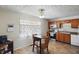 Eat-in kitchen features wood cabinets, stainless steel appliances, and tile floors at 633 Park Dr, Greenwood, IN 46143