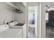 This laundry room includes a washer and dryer and storage at 633 Park Dr, Greenwood, IN 46143