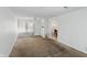 Bright living room with carpet and a view into the kitchen at 633 Park Dr, Greenwood, IN 46143