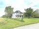 Charming two-story home with a covered front porch and mature trees in the yard at 660 N 700 E, Whitestown, IN 46075