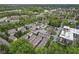 Aerial view of a residential community nestled near a scenic lake and surrounded by lush greenery and mature trees at 6665 Boxcar Pl, Indianapolis, IN 46220