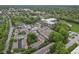 An aerial view of a well-maintained neighborhood surrounded by mature trees, and green spaces at 6665 Boxcar Pl, Indianapolis, IN 46220