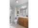 Bathroom featuring a glass shower, vanity, and coordinated decor elements at 6665 Boxcar Pl, Indianapolis, IN 46220