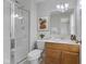 Bathroom featuring a glass shower, vanity, and coordinated decor elements at 6665 Boxcar Pl, Indianapolis, IN 46220