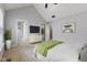 Bright primary bedroom with neutral tones, vaulted ceiling, and ample natural light at 6665 Boxcar Pl, Indianapolis, IN 46220