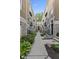 Charming courtyard featuring well-maintained landscaping, stone accents, and inviting walkways for a peaceful community setting at 6665 Boxcar Pl, Indianapolis, IN 46220