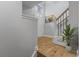 Inviting entryway with hardwood floors, staircase, and artwork on the wall at 6665 Boxcar Pl, Indianapolis, IN 46220