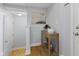 Neutral entryway with hardwood floors, console table, and closet at 6665 Boxcar Pl, Indianapolis, IN 46220